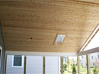 <b>Here is another photo from inside the screened porch during the building process.  You can see the ceiling is finished with tongue and groove cedar, and the skylight is already installed.</b>